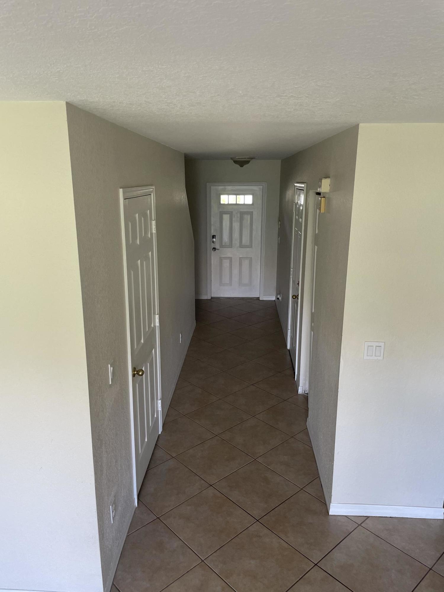 2215 Rockport Road Port St. Lucie, FL 34953 - Photo 8 of 33 Hall to Entrance