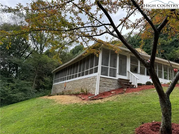 a view of house with backyard