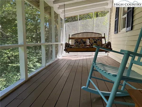 a view of a balcony with wooden floor