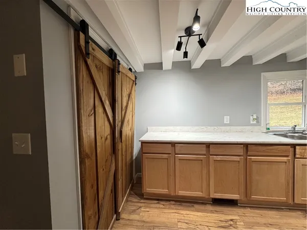a view of cabinets and wooden floor
