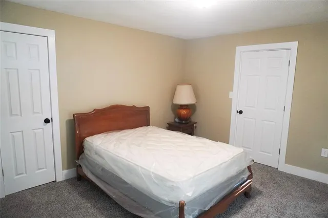 a bedroom with a bed and closet