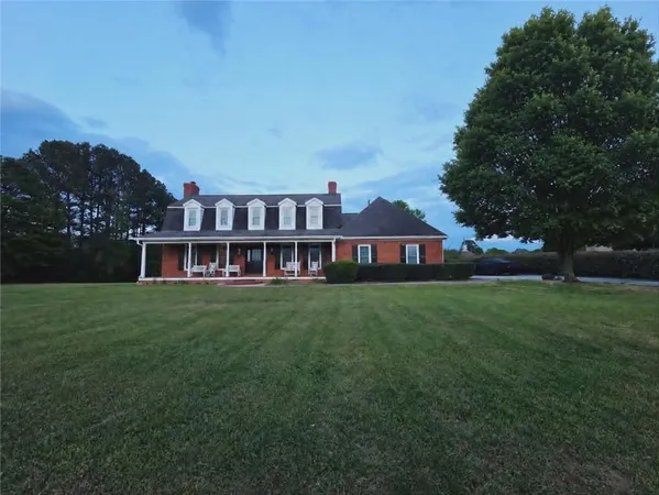 a view of a house with a big yard