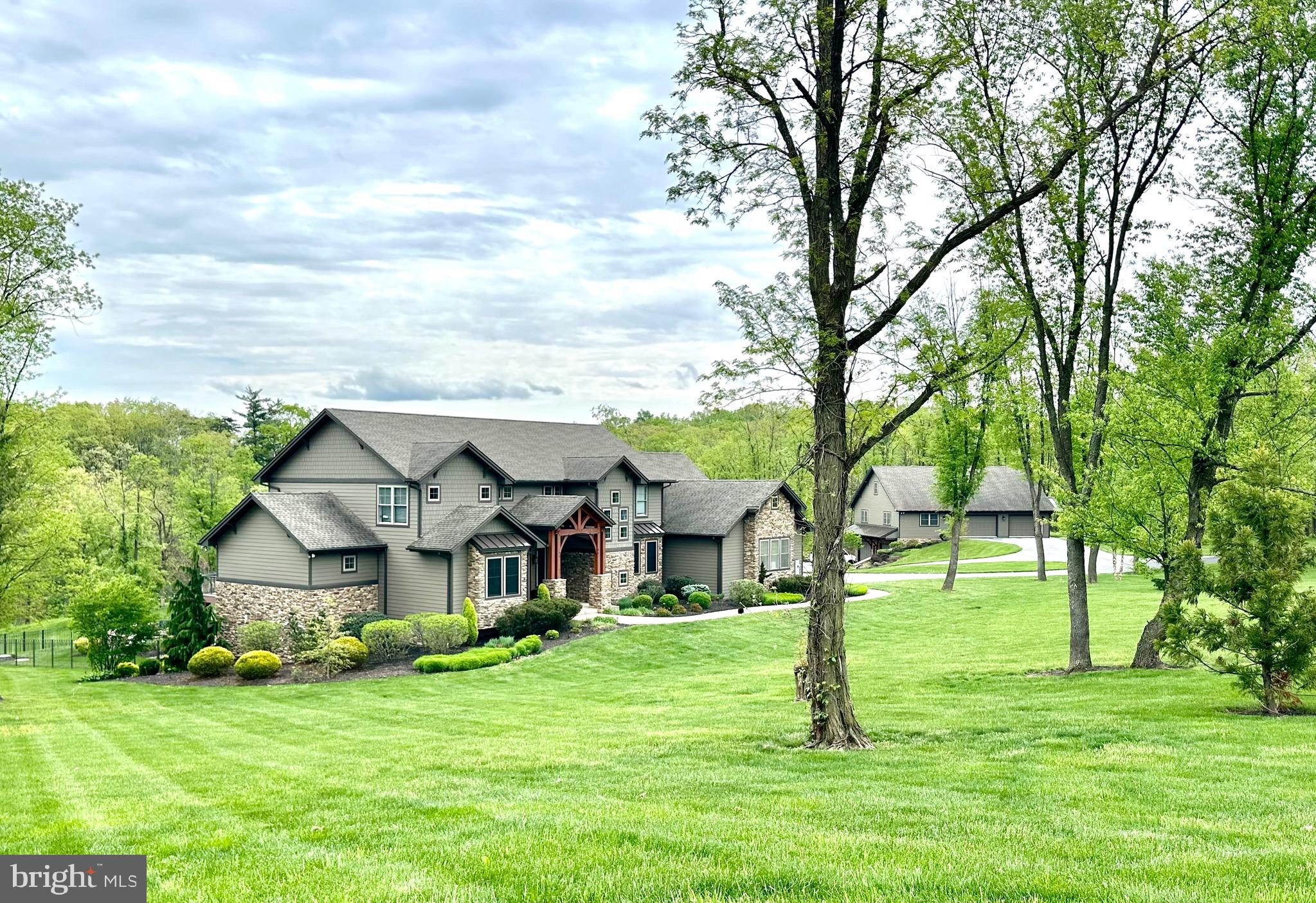 173 Jumper Road Newburg, PA 17240 - Photo 1 of 5 a view of a big house with a big yard and large trees