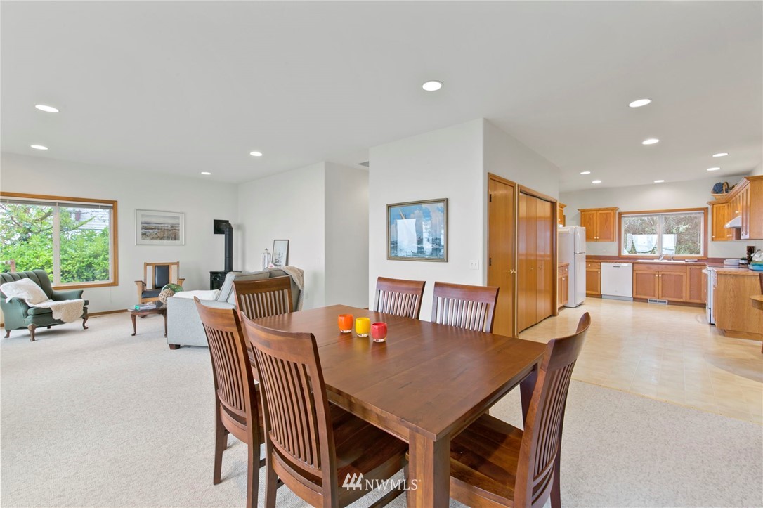 200 East Sund Road Grapeview, WA 98546 - Photo 13 of 40 a view of a dining room with furniture