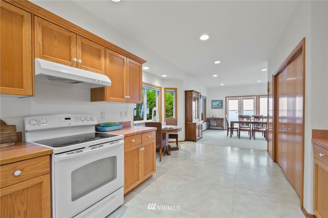 200 East Sund Road Grapeview, WA 98546 - Photo 14 of 40 a kitchen with stove and cabinets