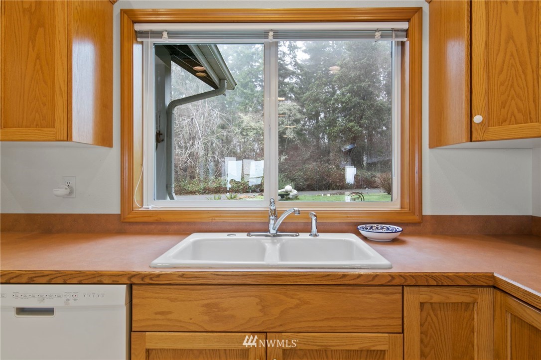 200 East Sund Road Grapeview, WA 98546 - Photo 15 of 40 a view of a sink and a window