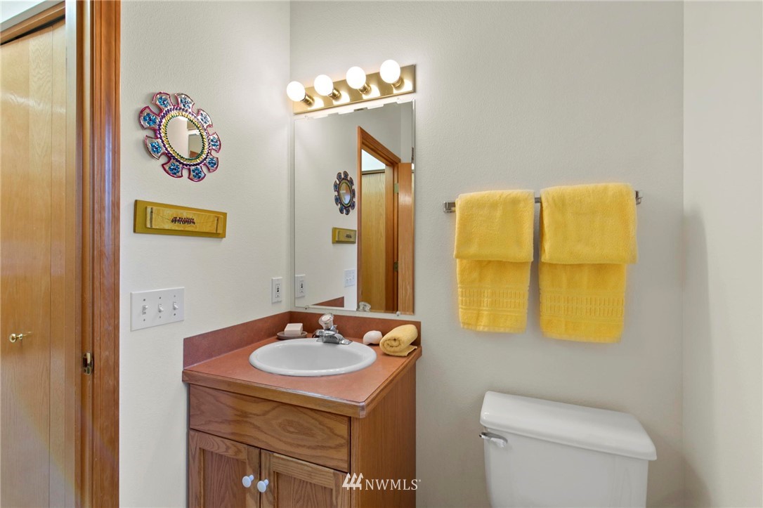 200 East Sund Road Grapeview, WA 98546 - Photo 21 of 40 a bathroom with a sink and a mirror