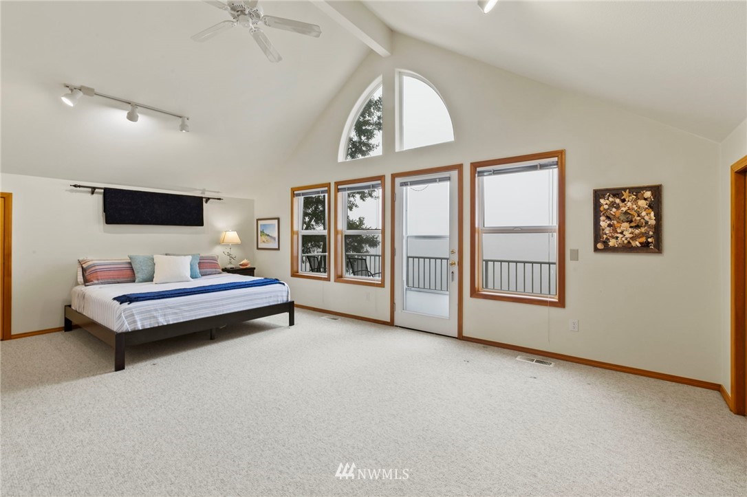 200 East Sund Road Grapeview, WA 98546 - Photo 24 of 40 a bedroom with furniture and a window