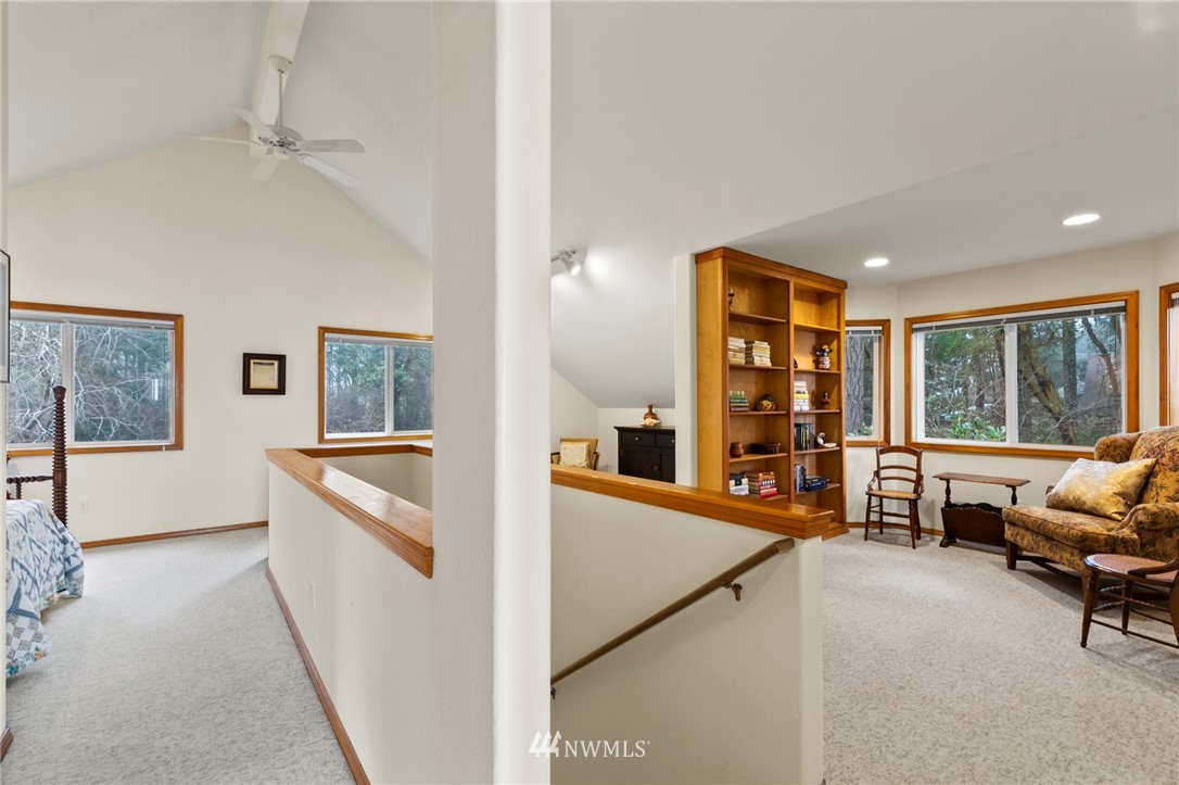 200 East Sund Road Grapeview, WA 98546 - Photo 27 of 40 a living room with furniture and a large window