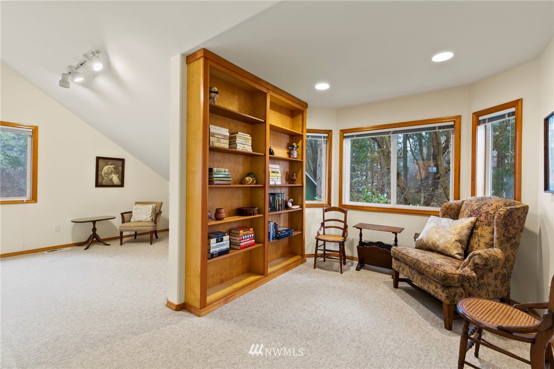 200 East Sund Road Grapeview, WA 98546 - Photo 28 of 40 a living room with furniture and a large window