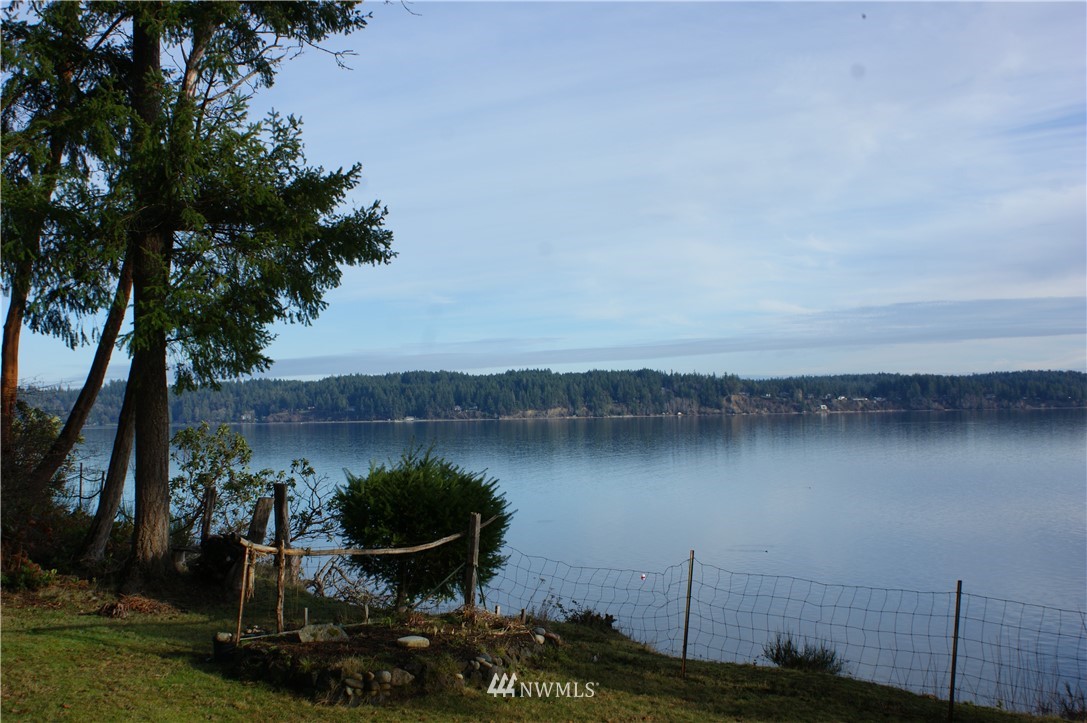 200 East Sund Road Grapeview, WA 98546 - Photo 32 of 40 a view of a lake with a mountain in the background