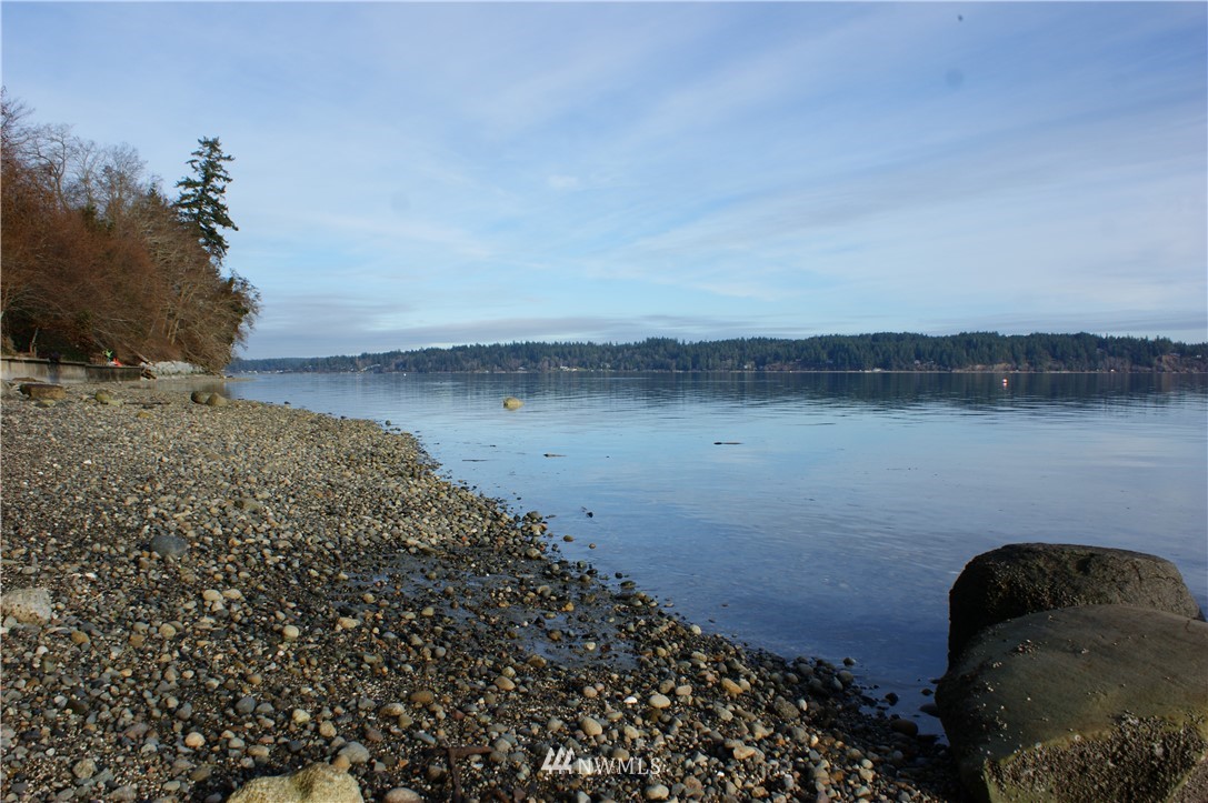 200 East Sund Road Grapeview, WA 98546 - Photo 38 of 40 a view of a lake with a mountain in the background