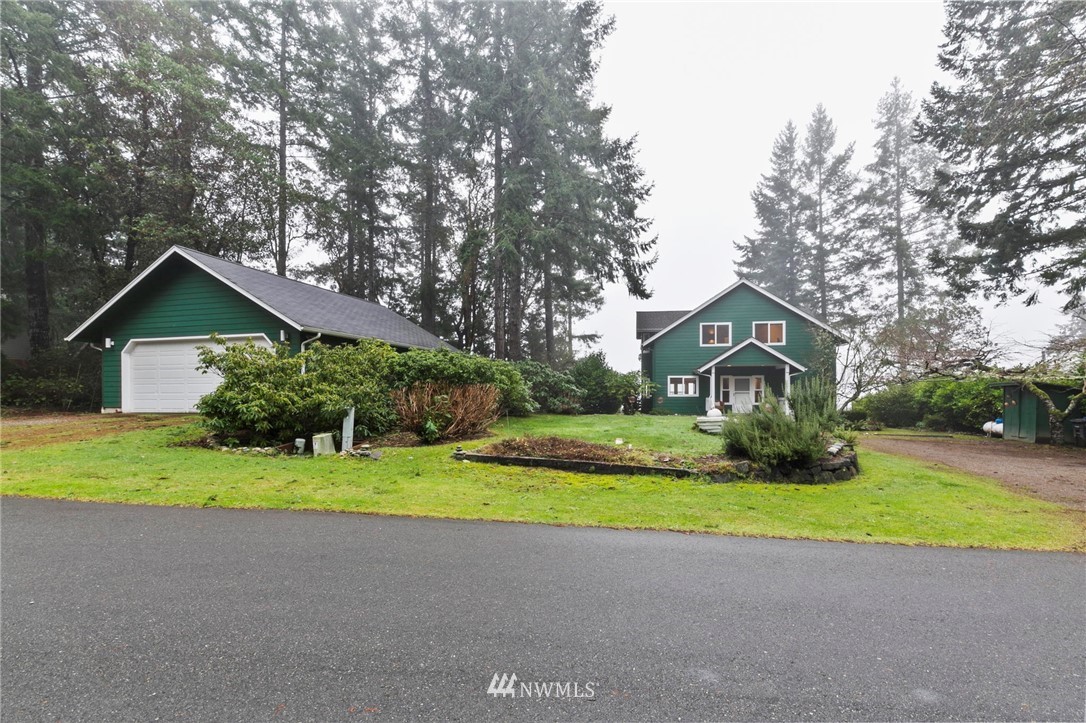 200 East Sund Road Grapeview, WA 98546 - Photo 4 of 40 a front view of house with yard and green space