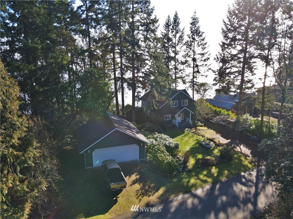 200 East Sund Road Grapeview, WA 98546 - Photo 6 of 40 a view of a house with a yard