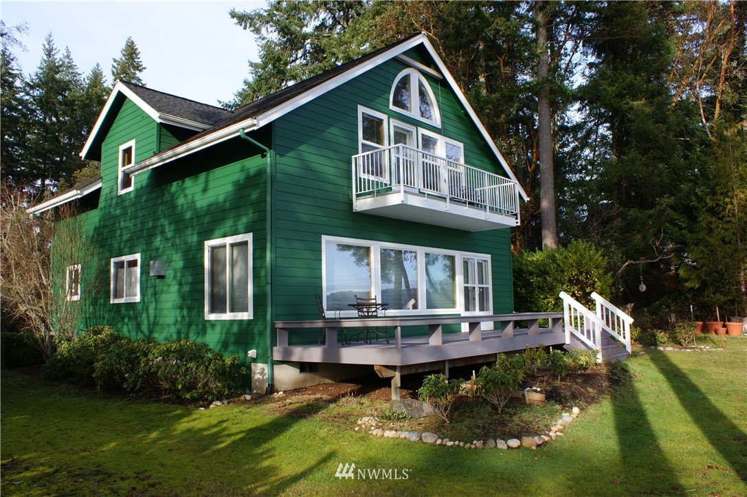 200 East Sund Road Grapeview, WA 98546 - Photo 9 of 40 a front view of a house with garden