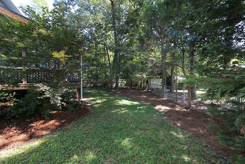 2104 Treverton Place Raleigh, NC 27609 - Photo 23 of 25 Play, play, play in this roomy, fenced back yard area. Back Yard