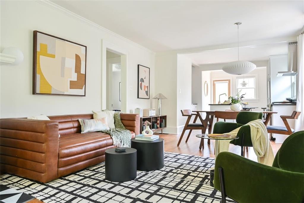 1085 Hardee Street Northeast, Unit A Atlanta, GA 30307 - Photo 1 of 32 a living room with furniture a rug and white walls