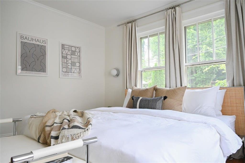 1085 Hardee Street Northeast, Unit A Atlanta, GA 30307 - Photo 15 of 32 a bedroom with a bed and a window