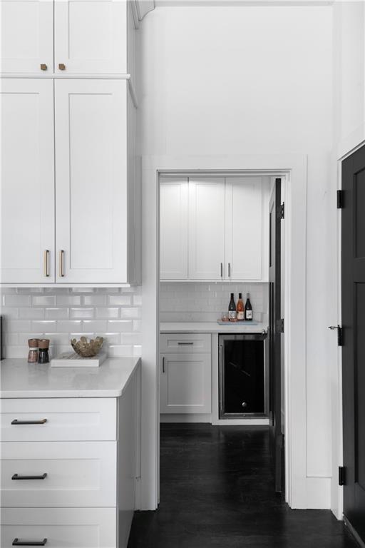 1085 Hardee Street Northeast, Unit A Atlanta, GA 30307 - Photo 17 of 32 a kitchen with a refrigerator and white cabinets