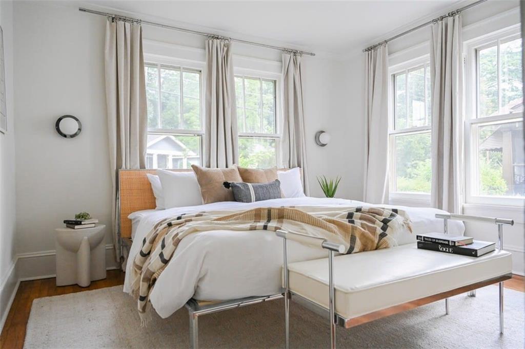 1085 Hardee Street Northeast, Unit A Atlanta, GA 30307 - Photo 2 of 32 a bed sitting in a bedroom next to a window