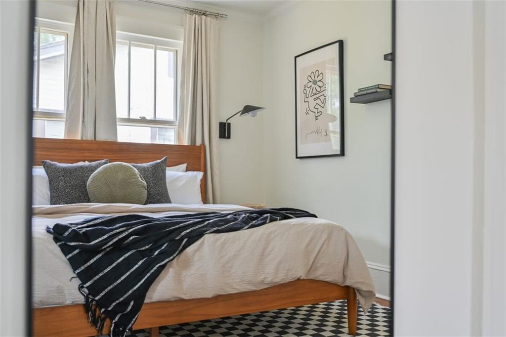 1085 Hardee Street Northeast, Unit A Atlanta, GA 30307 - Photo 25 of 32 a bedroom with a bed and a window