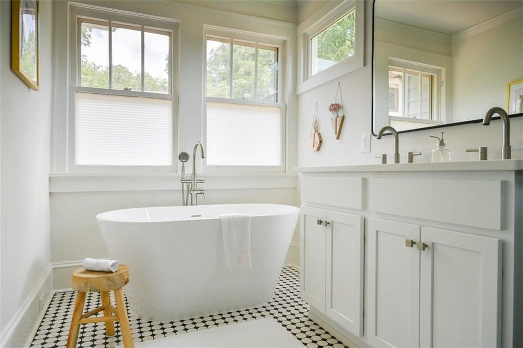 1085 Hardee Street Northeast, Unit A Atlanta, GA 30307 - Photo 26 of 32 a bathroom with a sink and a mirror