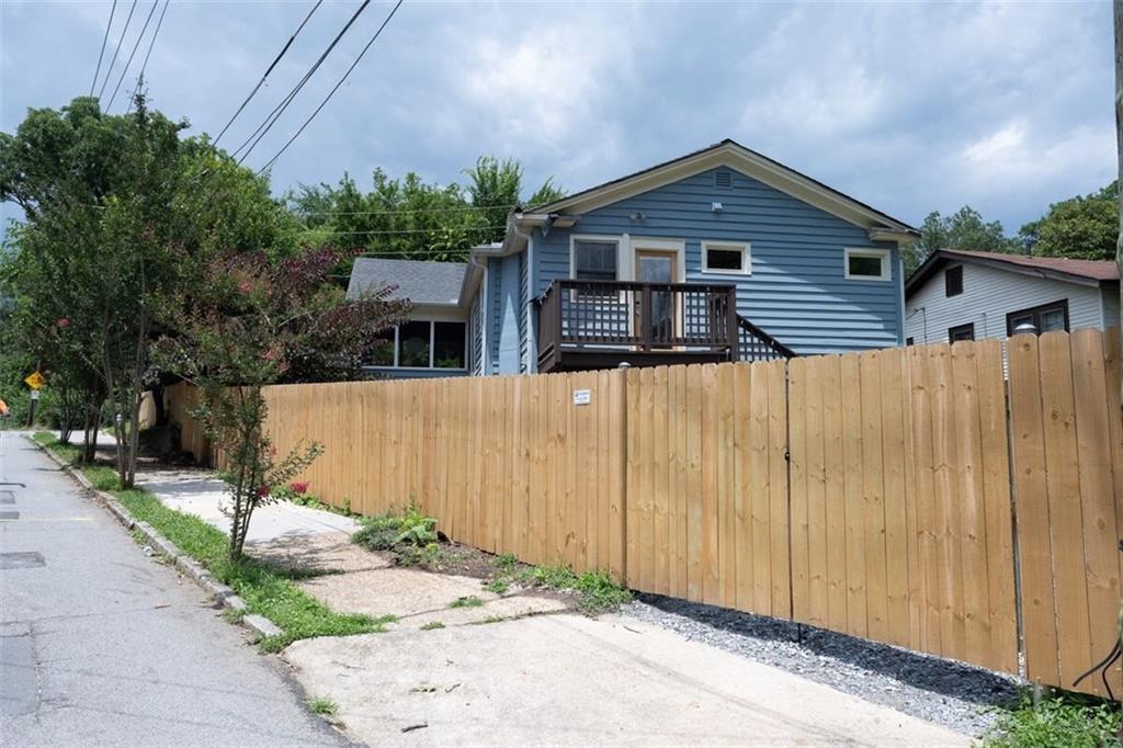 1085 Hardee Street Northeast, Unit A Atlanta, GA 30307 - Photo 31 of 32 a front view of a house with a yard