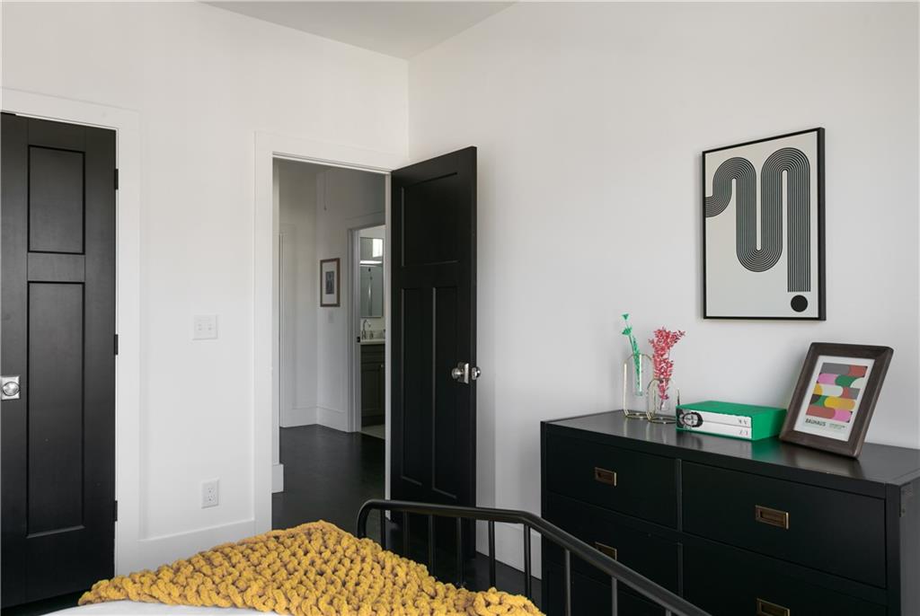 1085 Hardee Street Northeast, Unit A Atlanta, GA 30307 - Photo 32 of 32 a bedroom with a bed and furniture