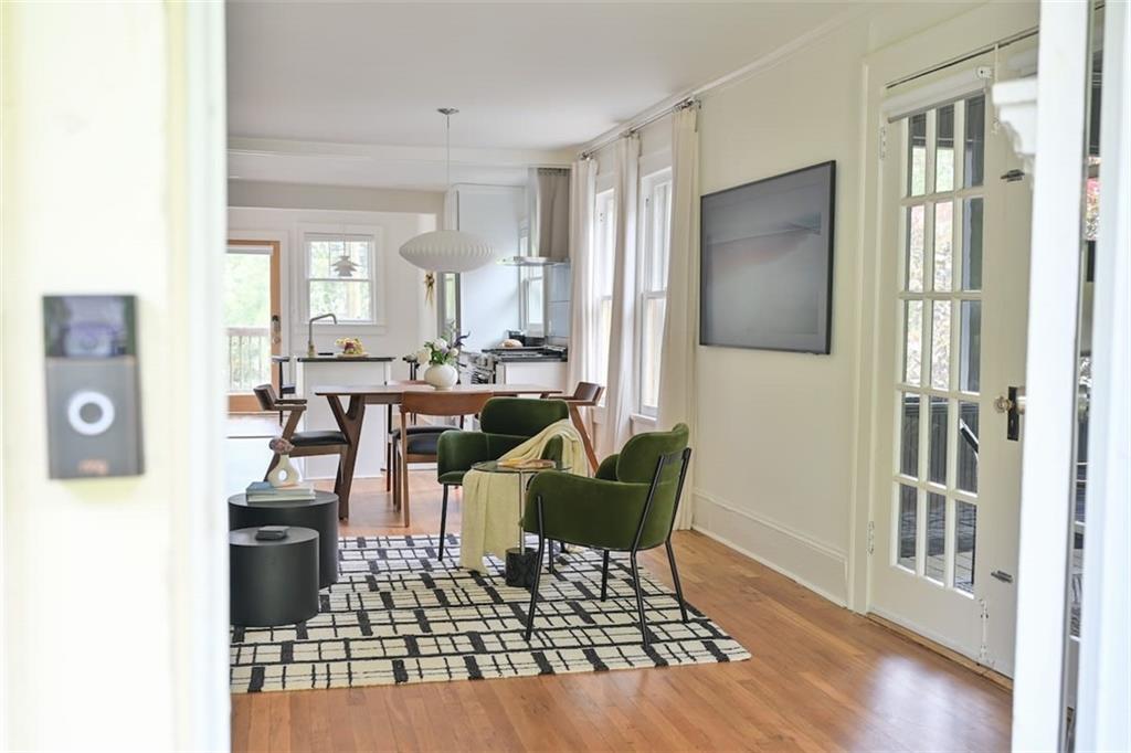 1085 Hardee Street Northeast, Unit A Atlanta, GA 30307 - Photo 6 of 32 a living room with furniture and a table