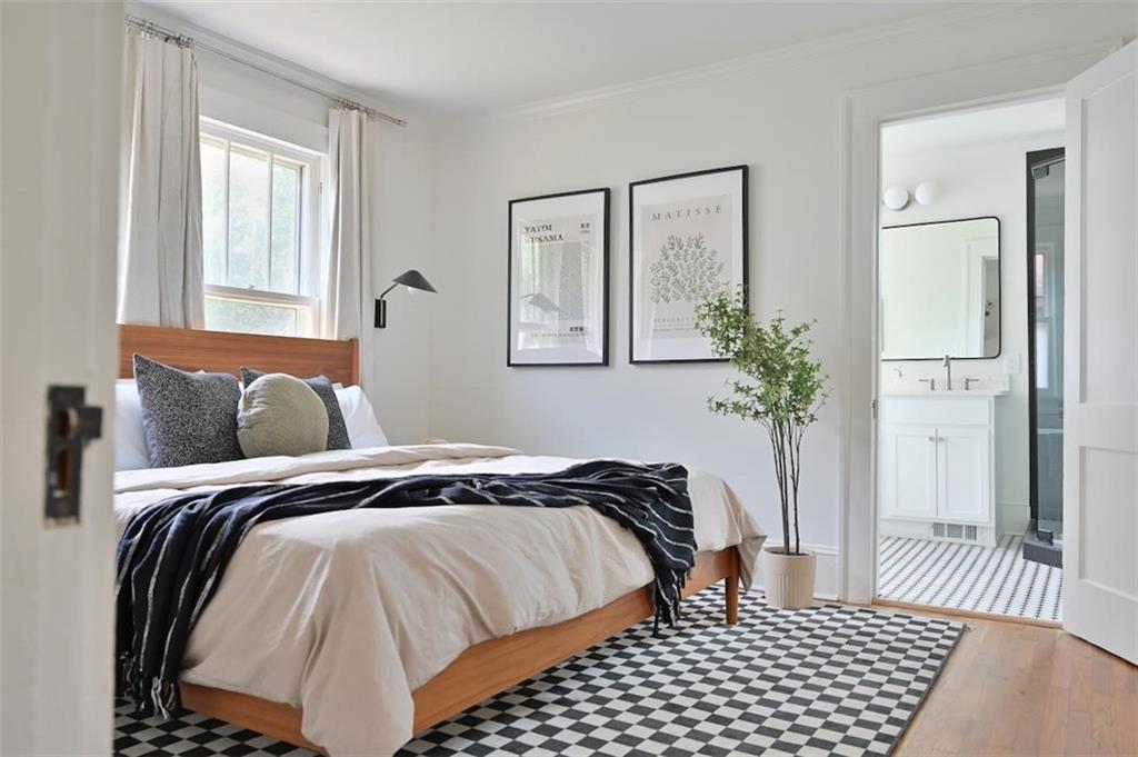 1085 Hardee Street Northeast, Unit A Atlanta, GA 30307 - Photo 7 of 32 a bedroom with a bed and a window