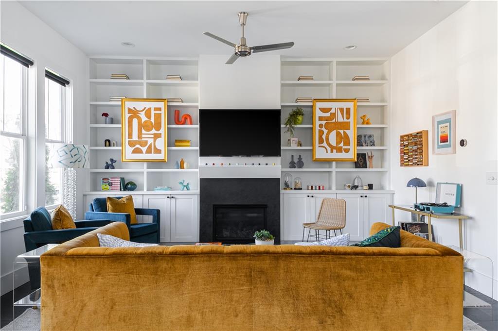 1085 Hardee Street Northeast, Unit A Atlanta, GA 30307 - Photo 8 of 32 a living room with fireplace furniture and a flat screen tv