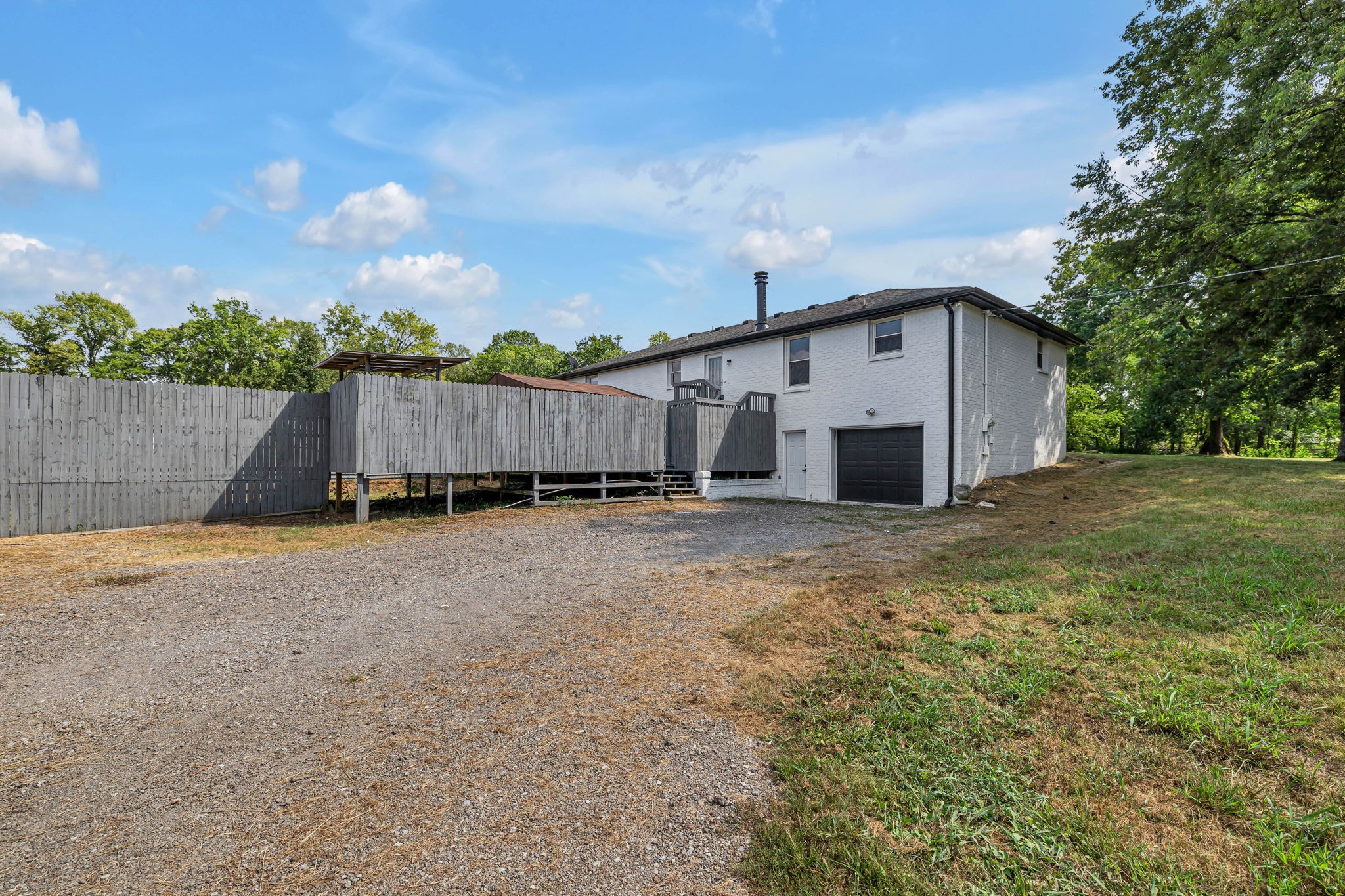 1177 Hamilton Chambers Road Lebanon, TN 37087 - Photo 38 of 42 a view of a house with backyard and wooden fence