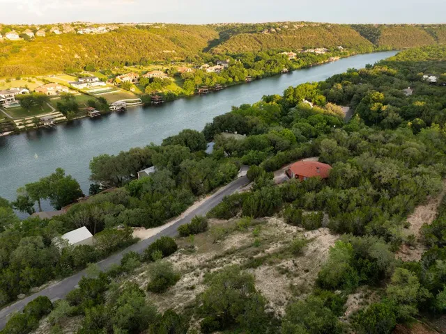 an aerial view of a house with a yard