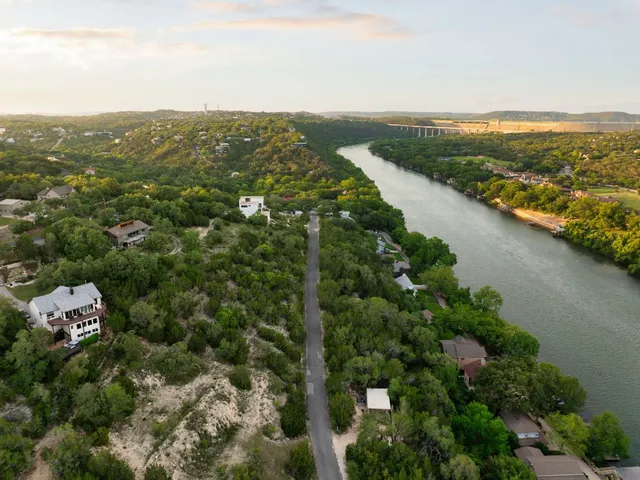 an aerial view of residential building and lake view