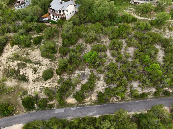 an aerial view of a house with a yard
