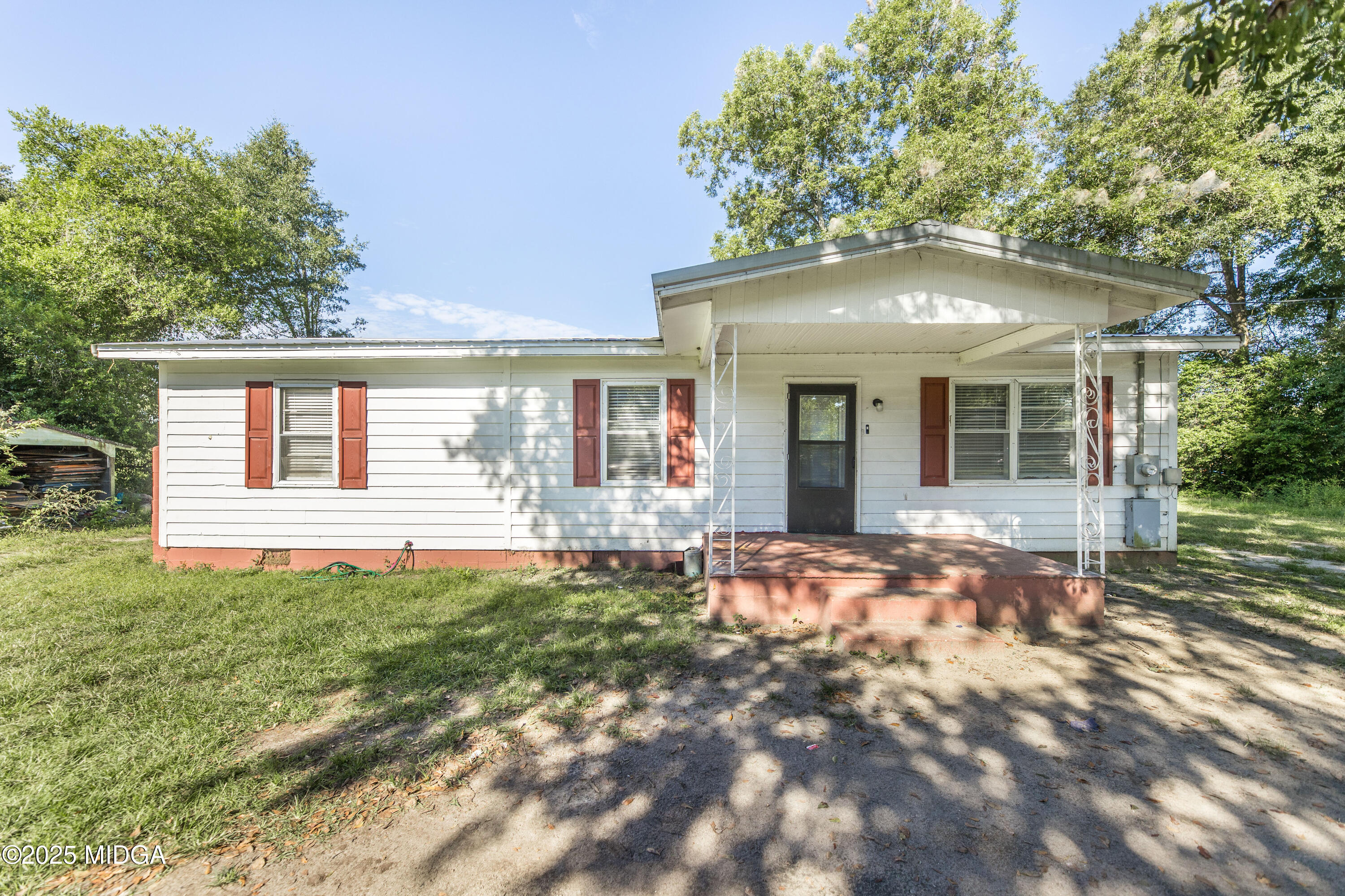 511 Forsyth Street Montezuma, GA 31063 - Photo 2 of 12 a front view of a house with a yard