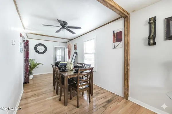 a view of a dining room with furniture and window