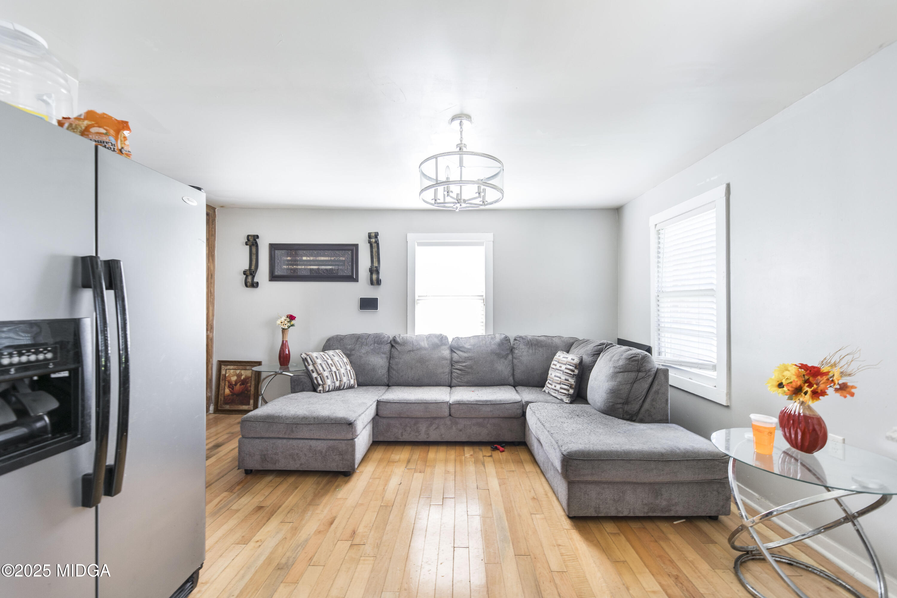 511 Forsyth Street Montezuma, GA 31063 - Photo 6 of 12 a living room with furniture and a chandelier
