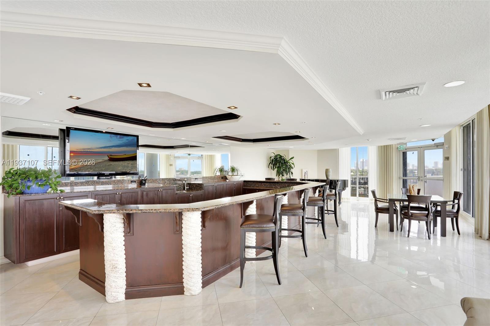 100 South Birch Road, Unit 1103F Fort Lauderdale, FL 33316 - Photo 55 of 80 Club Room w/ bar area for serving & for meetings, get togethers and rentals. Baby Grand Piano in corner