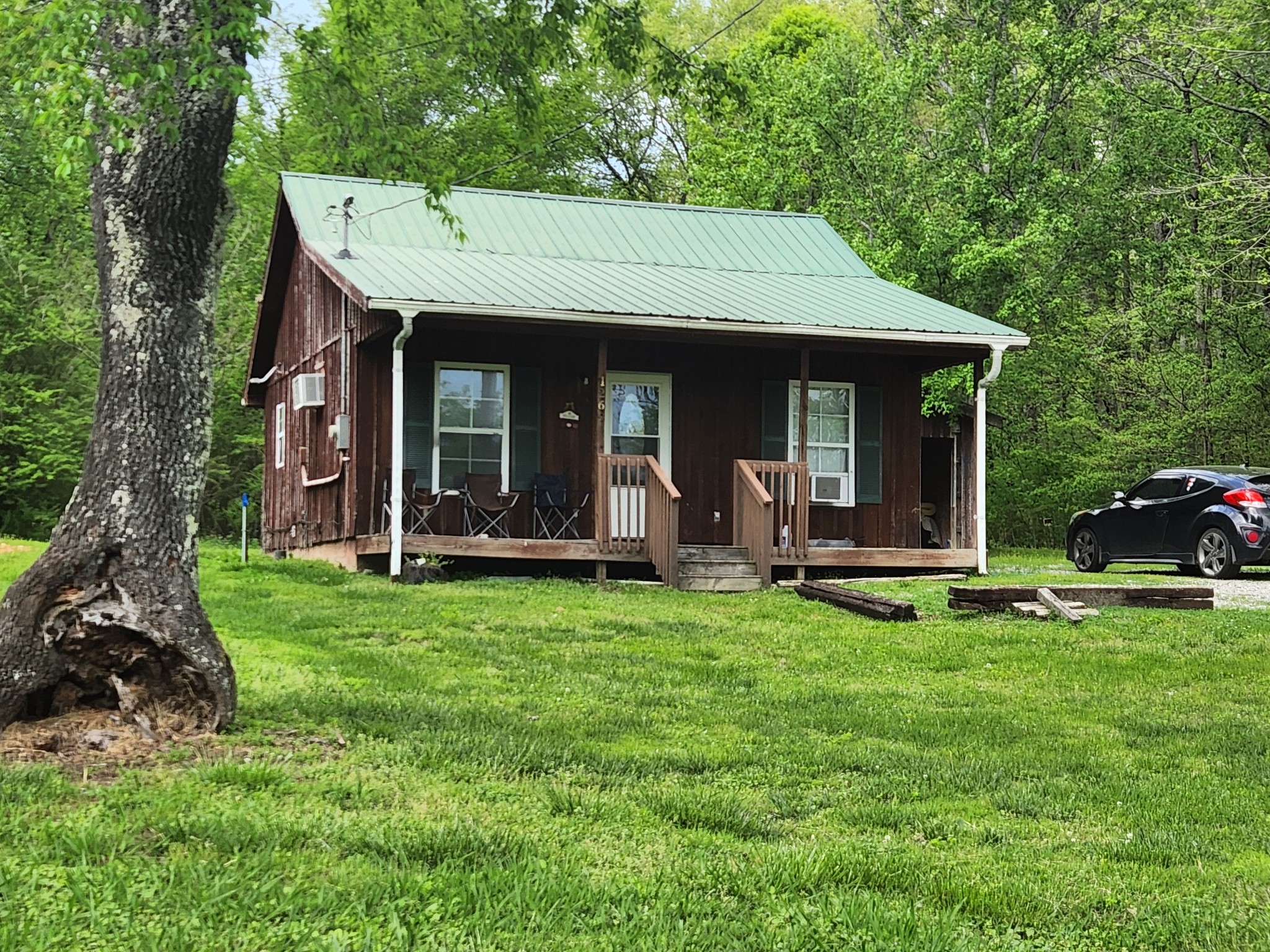1261 Garton Road Burns, TN 37029 - Photo 7 of 11 a view of a house with backyard porch and sitting area