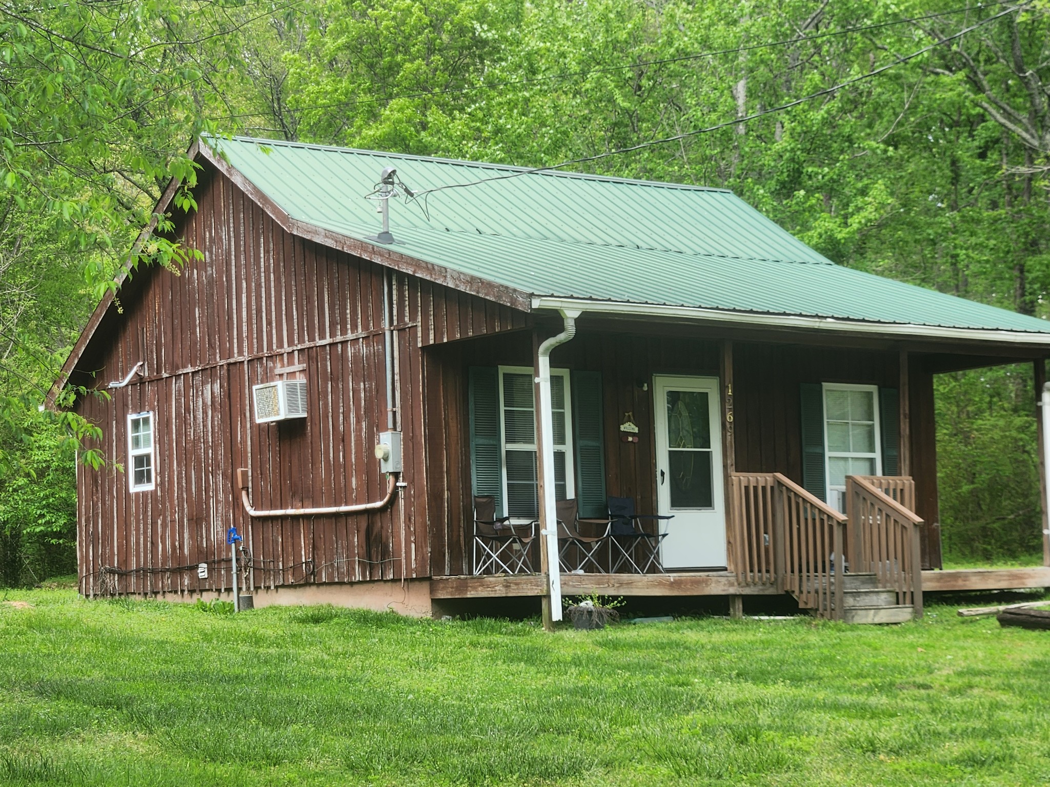 1261 Garton Road Burns, TN 37029 - Photo 8 of 11 a view of a house with a garden