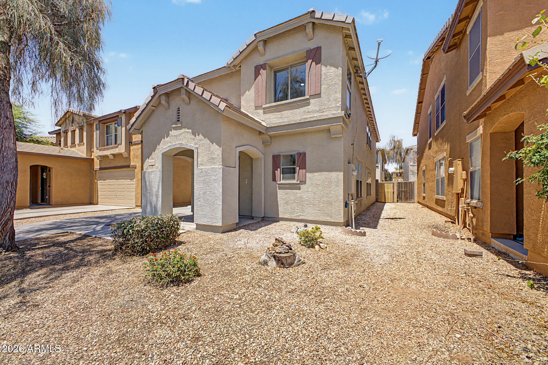 6452 West Ruth Avenue Glendale, AZ 85302 - Photo 3 of 35 a front view of a house with a yard