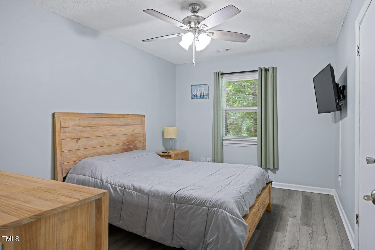 2906 Apollo Street Durham, NC 27704 - Photo 12 of 23 a bedroom with a bed and a window