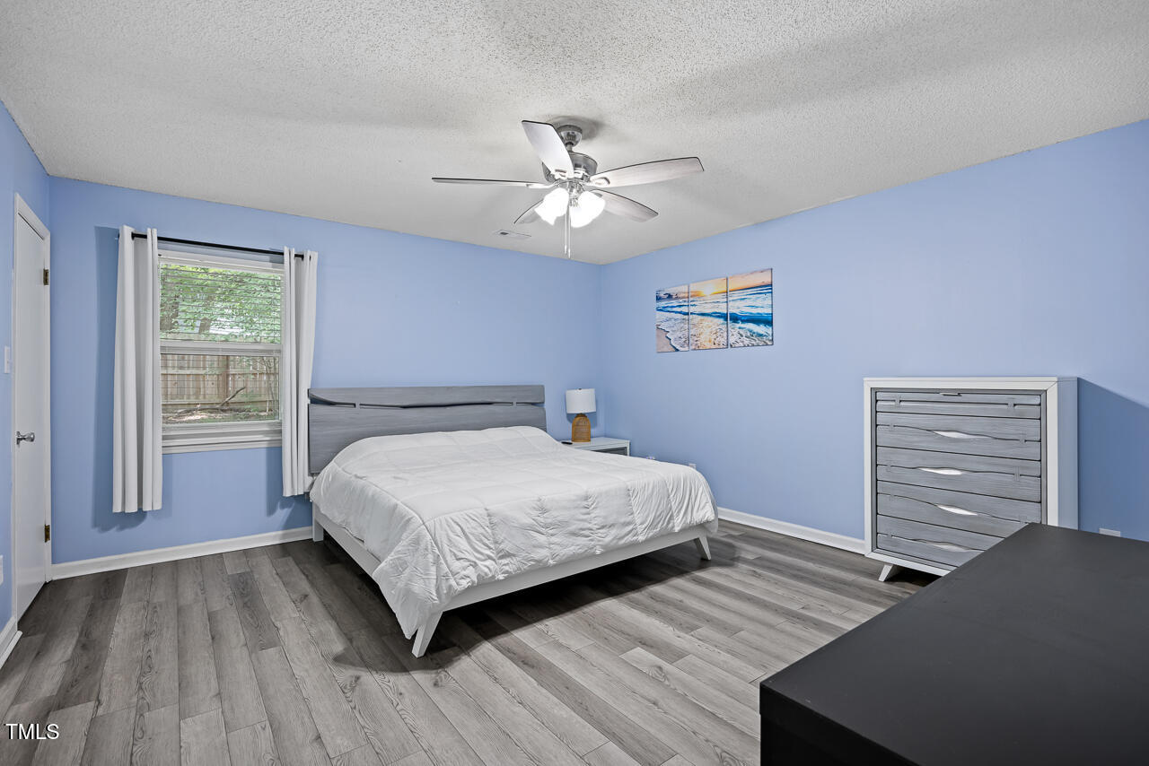 2906 Apollo Street Durham, NC 27704 - Photo 14 of 23 a bedroom with a bed and a window