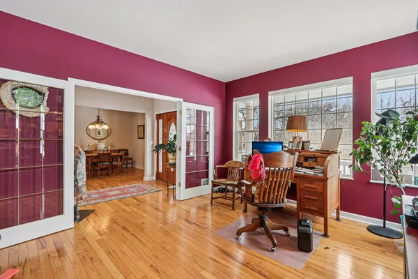 a view of a livingroom with furniture a table and chairs