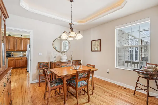 a view of a dining room with furniture window and wooden floor