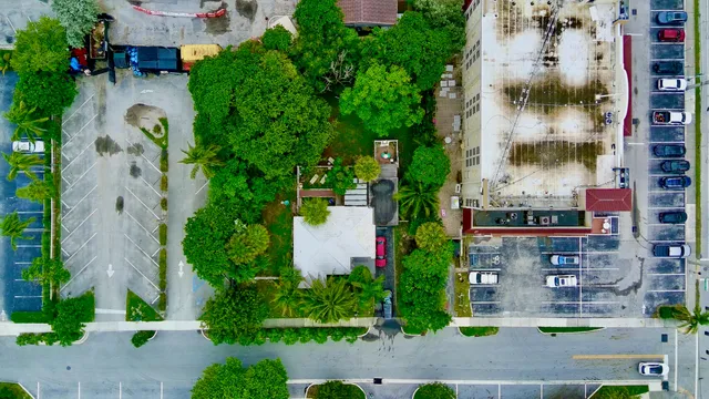 an aerial view of multiple houses with yard