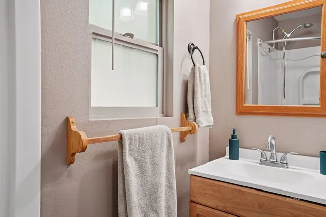 a bathroom with a sink and a mirror