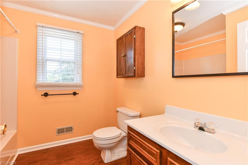 1104 Ridgecliff Drive Rural Hall, NC 27045 - Photo 22 of 28 The 3rd full bath is upstairs, between the 2nd & 3rd bedrooms. Handsome laminate flooring! and CLEAN!!