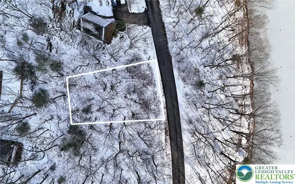 a view of snow on the side of a road